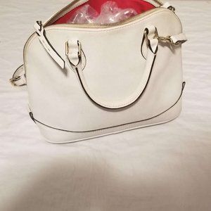 Women's white handbag with red interior